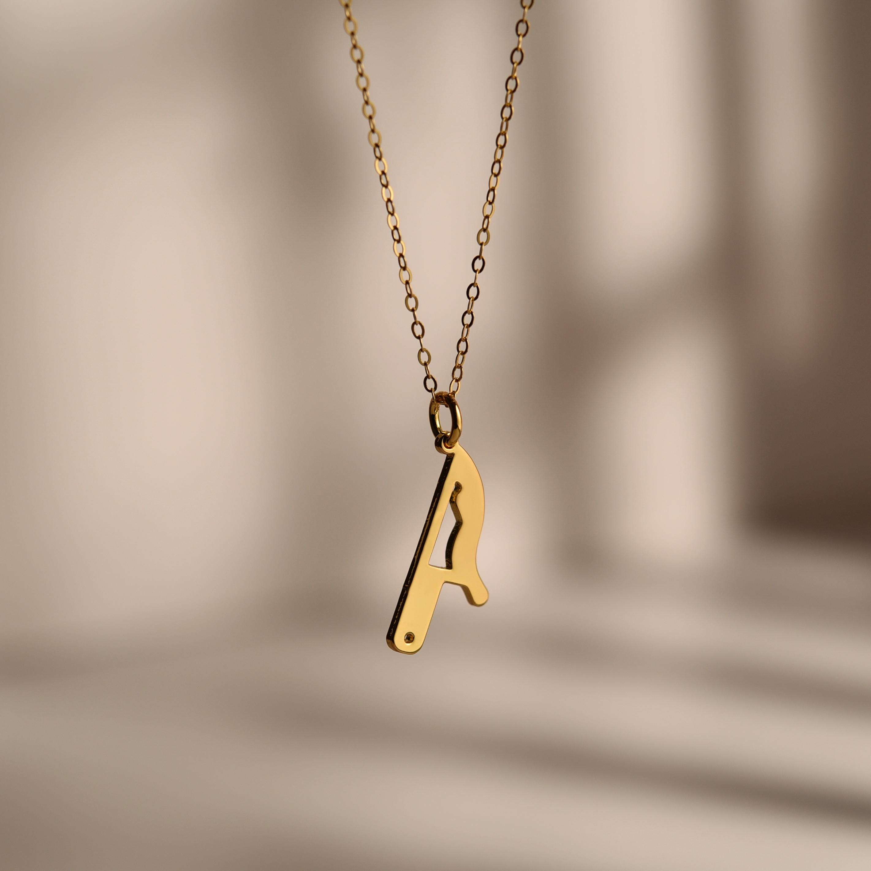Gold Dripping Knife Pendant Necklace